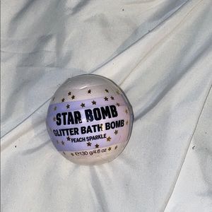 A peach sparkle bath bomb